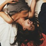 a person lying on a bed