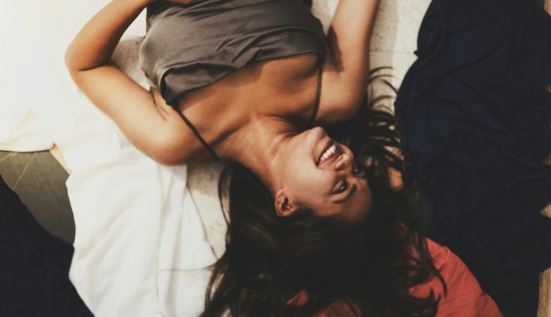 a person lying on a bed